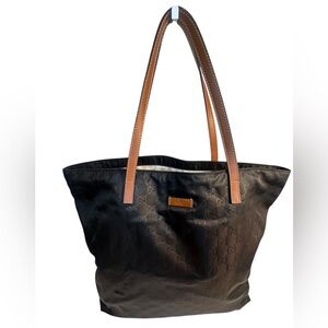 Authentic Gucci Black Nylon Tote Bag with brown leather shoulder straps.